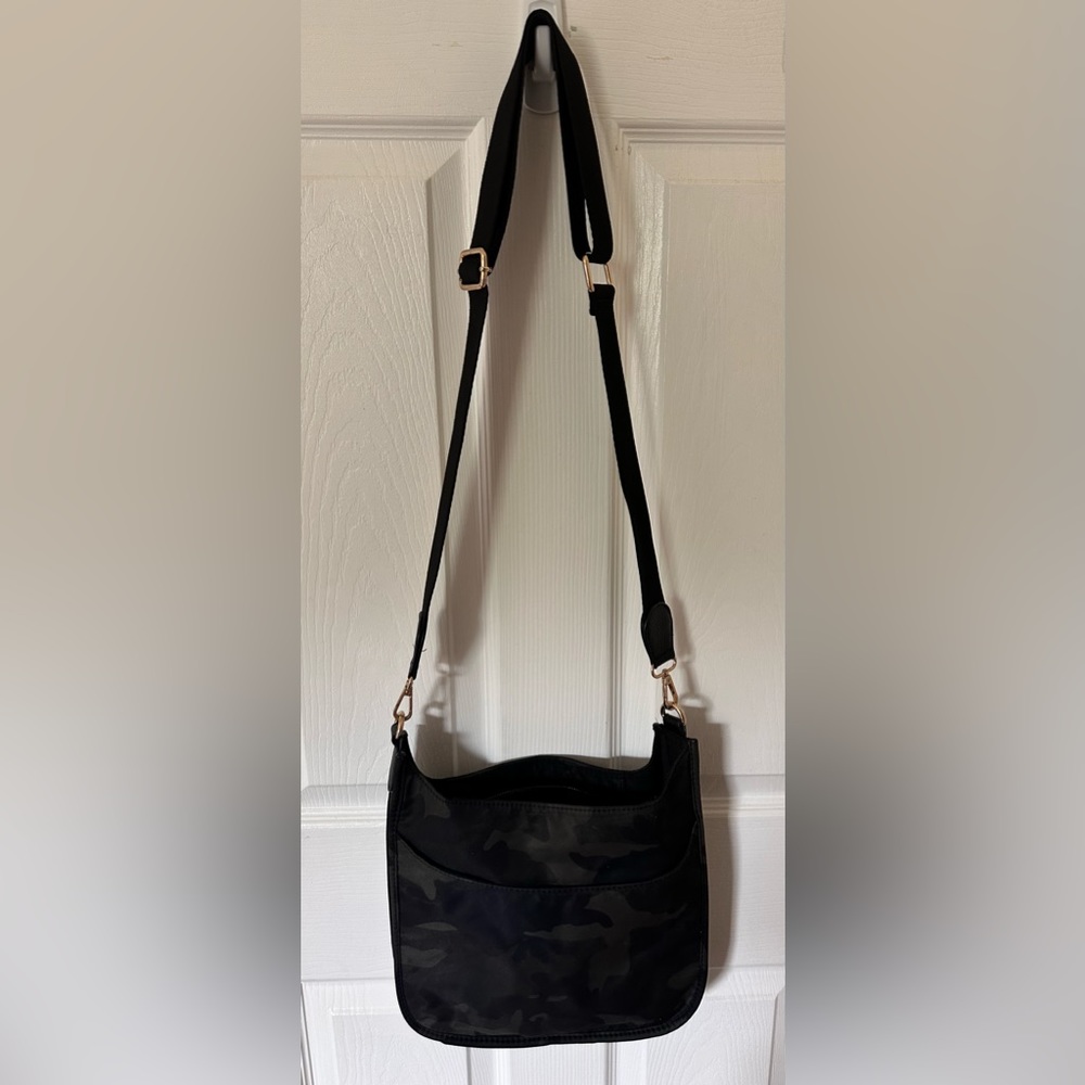 Black camo cross body bag in great condition.